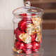 Glass sweet jar filled with chocolate truffles 